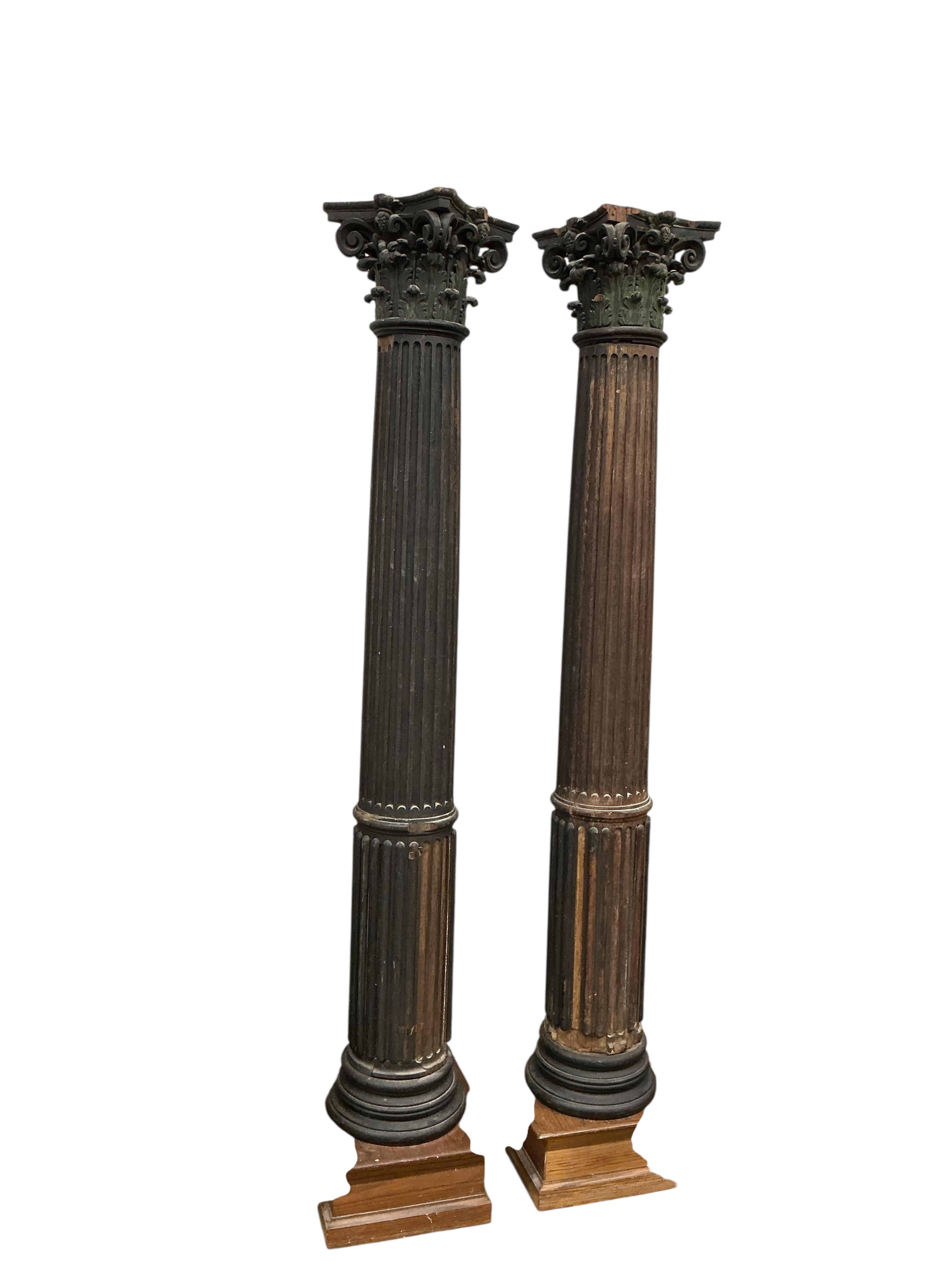 A pair of 17th century oak Corinthian columns, of large size, height 279cm, from St Mary le Bow, designed by Christopher Wren